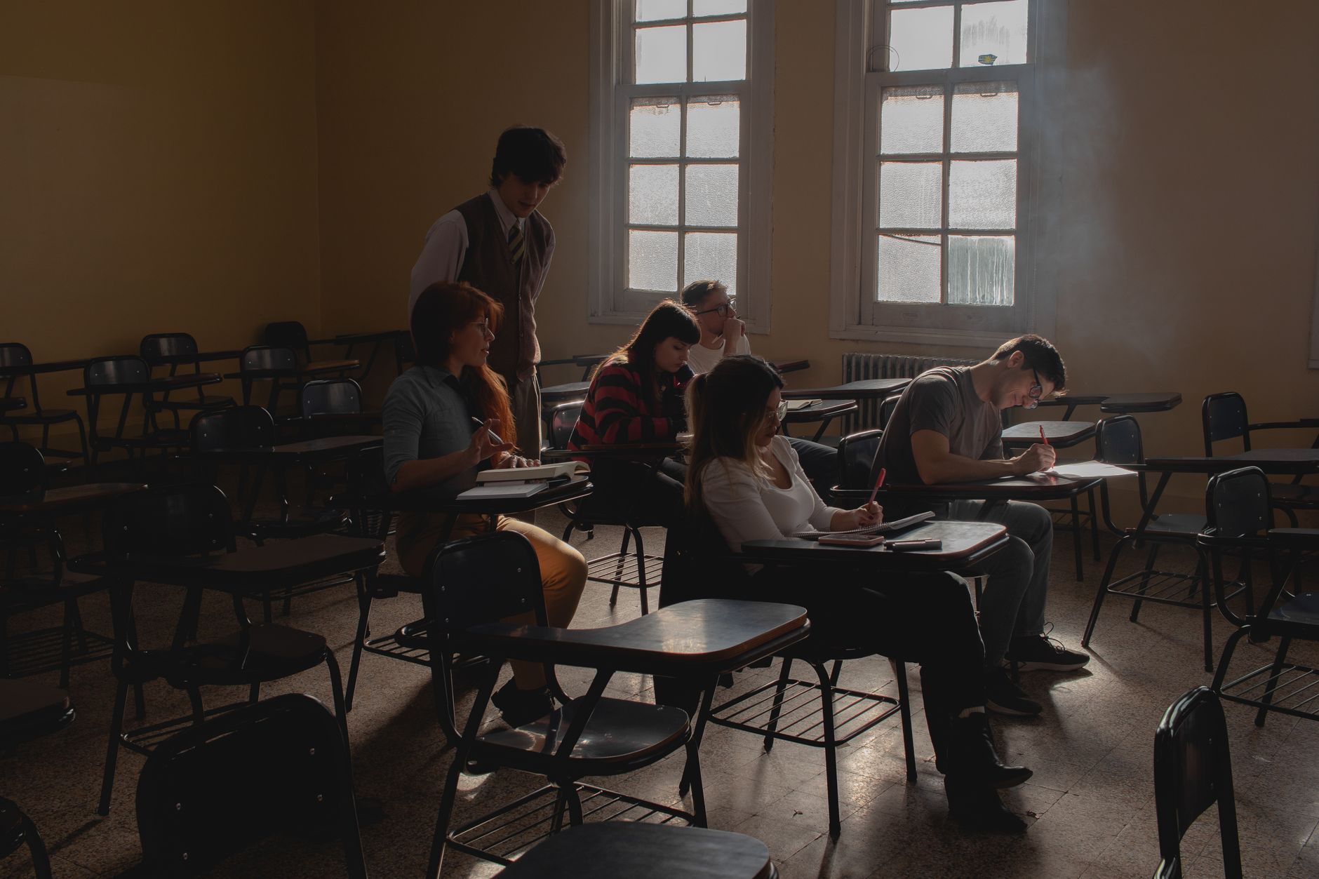 Adult students studying together in a classroom